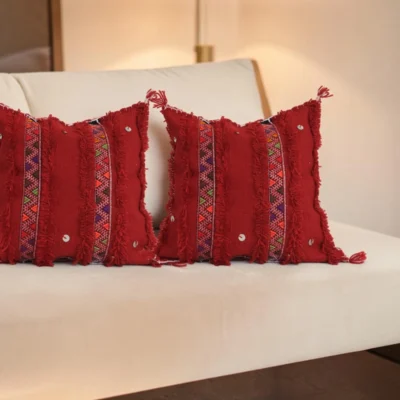 Red Moroccan Atlas Mountain wool pillow styled on sofa, Berber tribal design, home decor