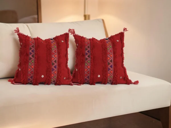 Red Moroccan Atlas Mountain wool pillow styled on sofa, Berber tribal design, home decor