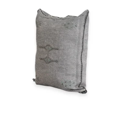 Handwoven grey cactus silk cushion cover with berber motifs on white background