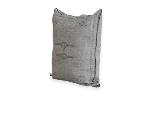 Handwoven grey cactus silk cushion cover with berber motifs on white background
