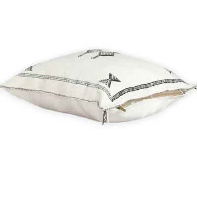 White Moroccan throw pillow with black geometric Berber embroidery
