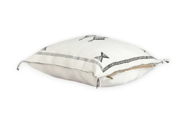 White Moroccan throw pillow with black geometric Berber embroidery