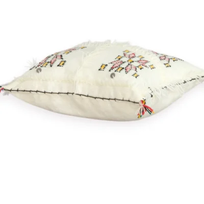 Close-up of Berber weaving on ivory wool pillow