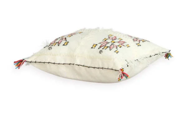 Close-up of Berber weaving on ivory wool pillow