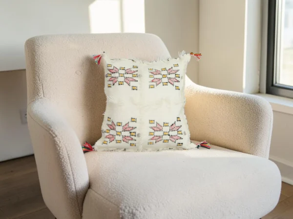 Ivory Moroccan wool pillow styled on armchair