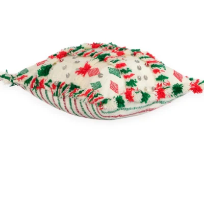 Angled view of Amazigh wool pillow showing red and green tufts and sequin details