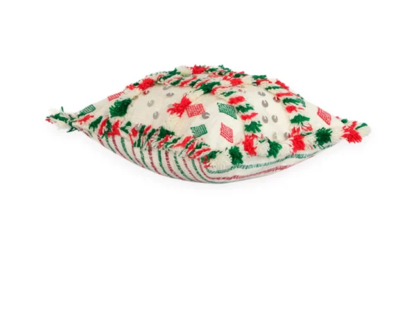 Angled view of Amazigh wool pillow showing red and green tufts and sequin details