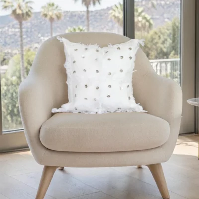 White Moroccan Handira wool pillow styled on beige accent chair boho living room