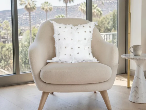 White Moroccan Handira wool pillow styled on beige accent chair boho living room