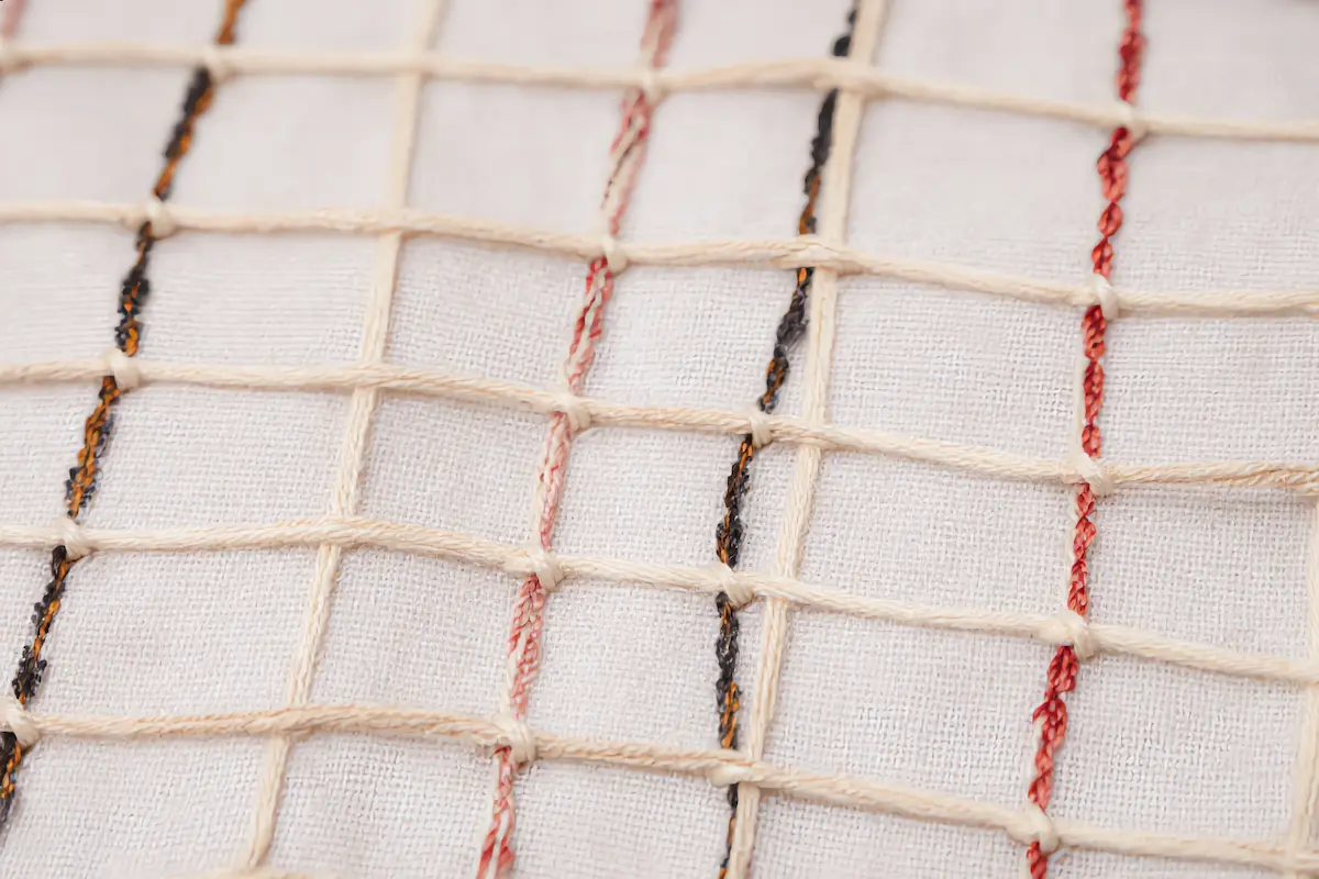 Close-up of the back of an authentic hand-knotted Azilal rug showing individual knots and warp threads