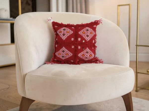 Pair of Moroccan red Berber pillows on white armchair bohemian decor