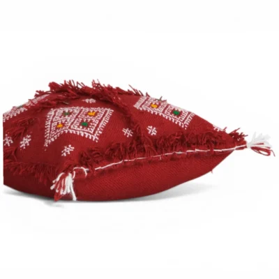 Close-up wool fringes and silver sequins Moroccan Berber pillow Khenifra