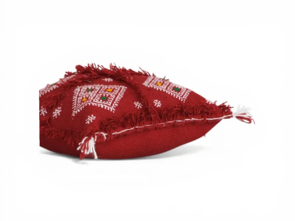 Close-up wool fringes and silver sequins Moroccan Berber pillow Khenifra