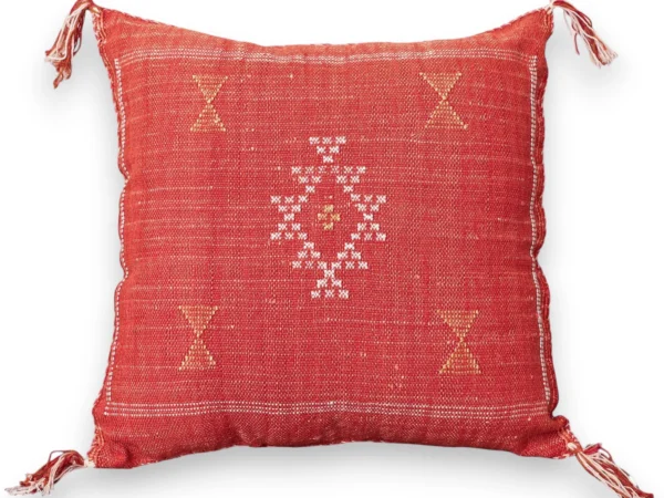 Burnt orange Sabra silk pillow handwoven with a white and yellow Amazigh Berber star motif, front view