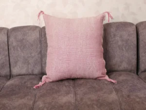 Blush Sabra Silk Pillow with subtle Berber geometric motifs on grey sofa — handwoven Moroccan cactus silk cushion