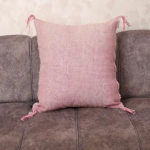 Blush Sabra Silk Pillow with subtle Berber geometric motifs on grey sofa — handwoven Moroccan cactus silk cushion