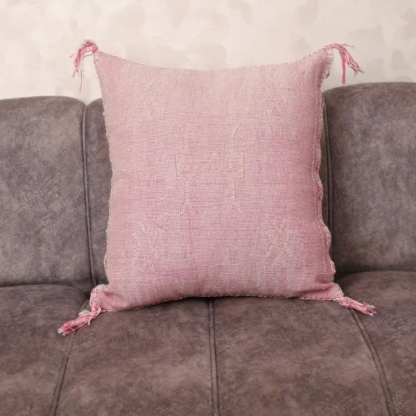 Blush Sabra Silk Pillow with subtle Berber geometric motifs on grey sofa — handwoven Moroccan cactus silk cushion