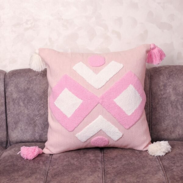 Blush Tufted Berber Pillow with tassel edge on grey sofa — handwoven Moroccan artisan cushion cover